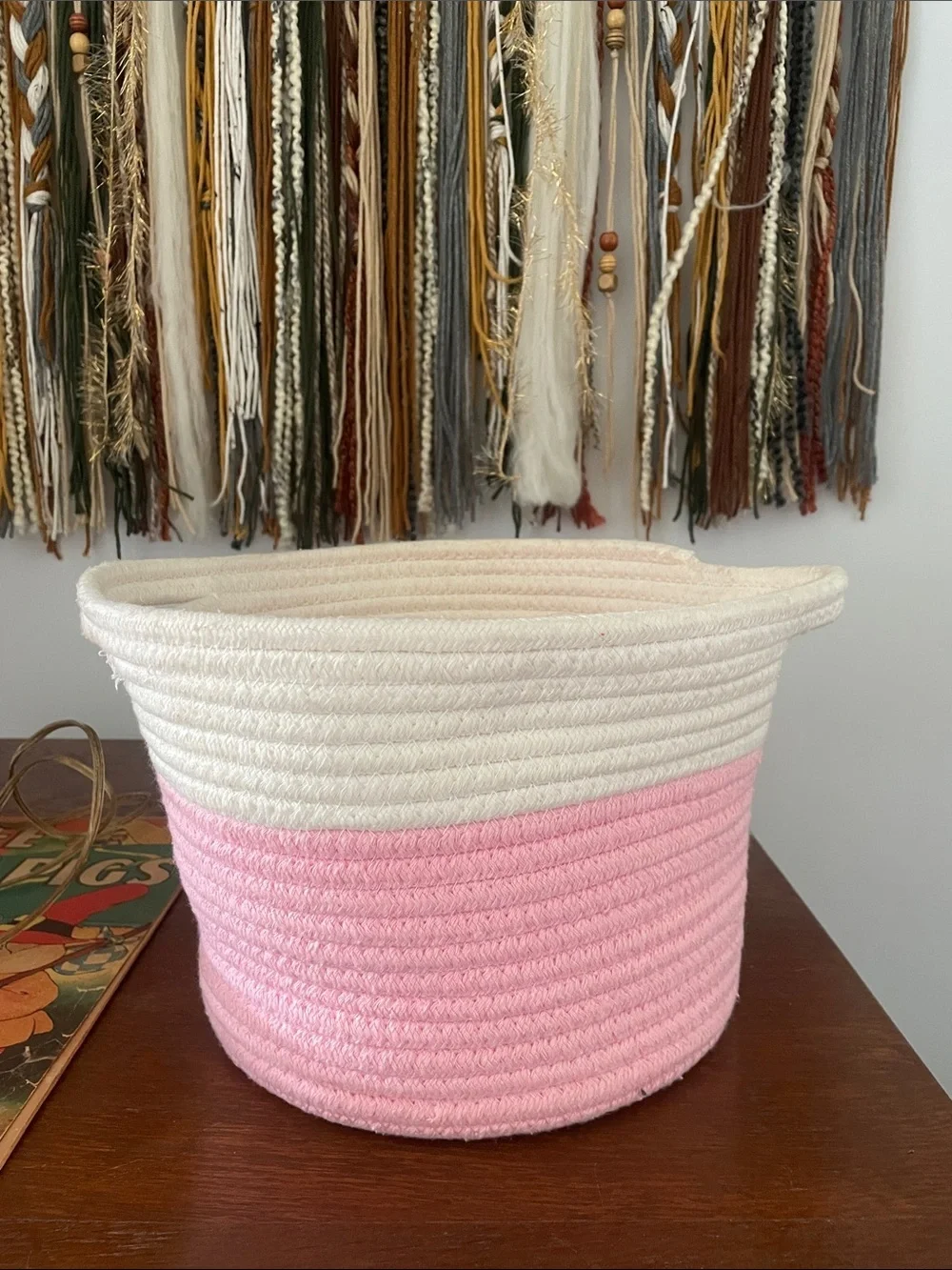Pink and white braided basket with handles